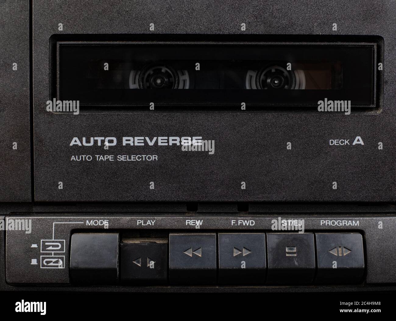 Close up front a deck recorder of the vintage stereo cassette tape