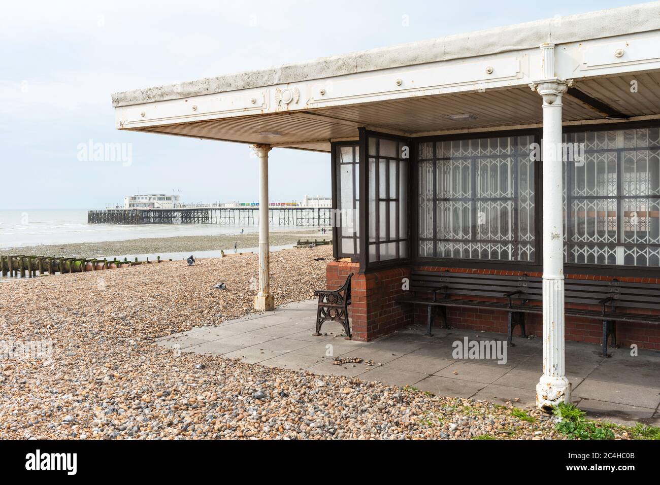 Seaside shelter overlooking Worthing Beach with Worthing Pier beyond, Worthing, West Sussex, England, UK. Stock Photo