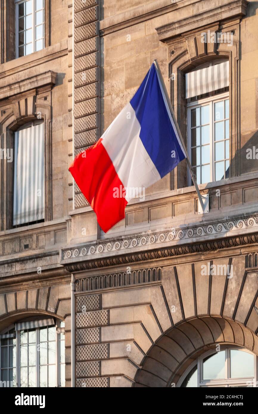 Tricolour flag on a building in Paris, France Stock Photo