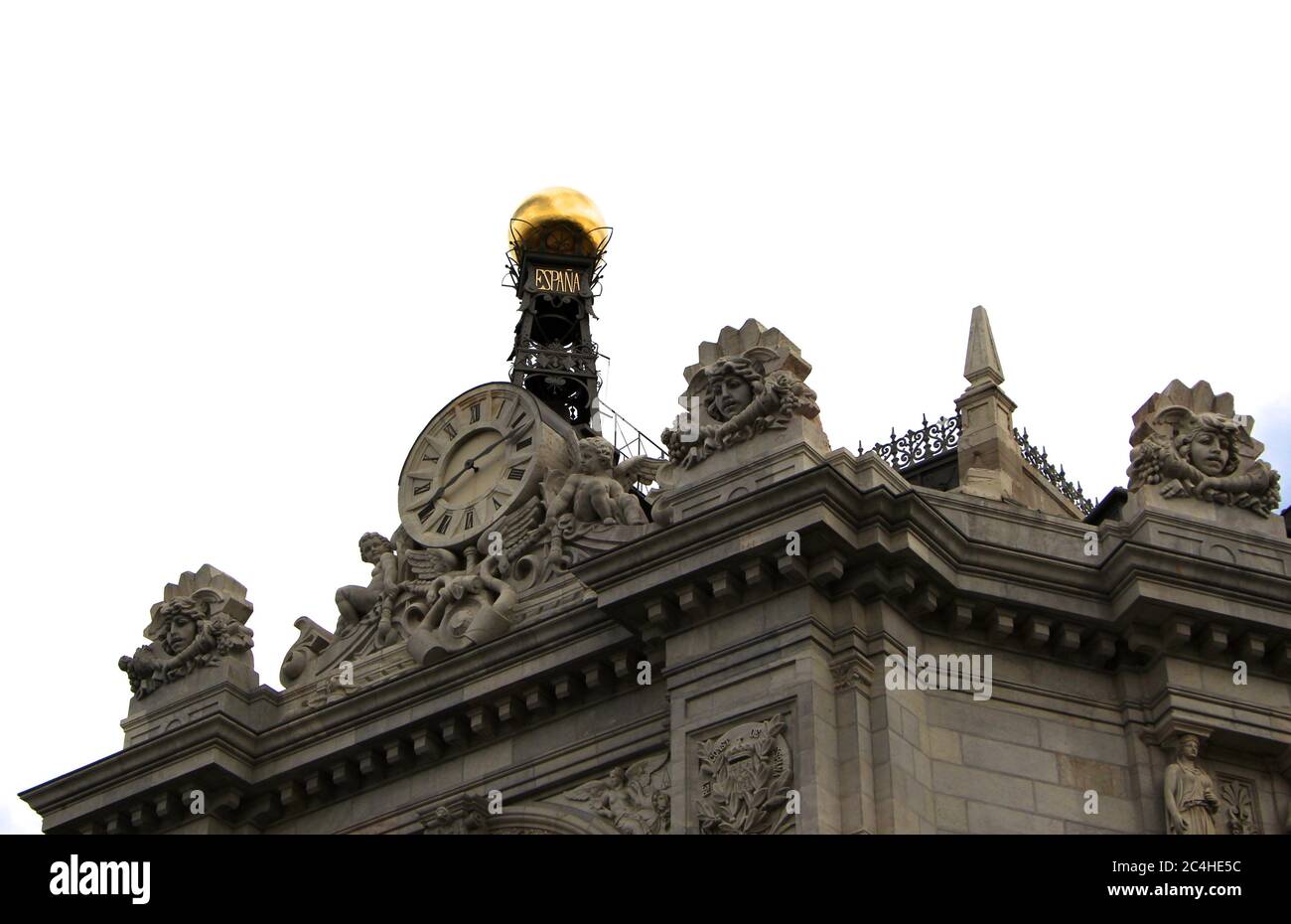 Close up of the clock and gold ball at the top of Bank of Spain head office Calle de Alcala 48 Madrid Stock Photo
