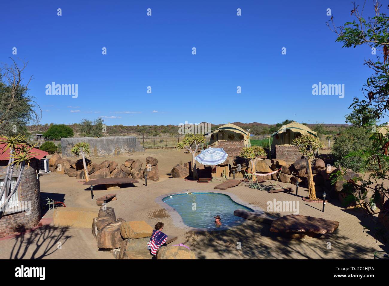 KEETMANSHOOP, NAMIBIA - JAN 25, 2016: Swimming pool in Quivertree Forest Rest Camp,  where visitors can explore the ancient and famous Quivertree Fore Stock Photo