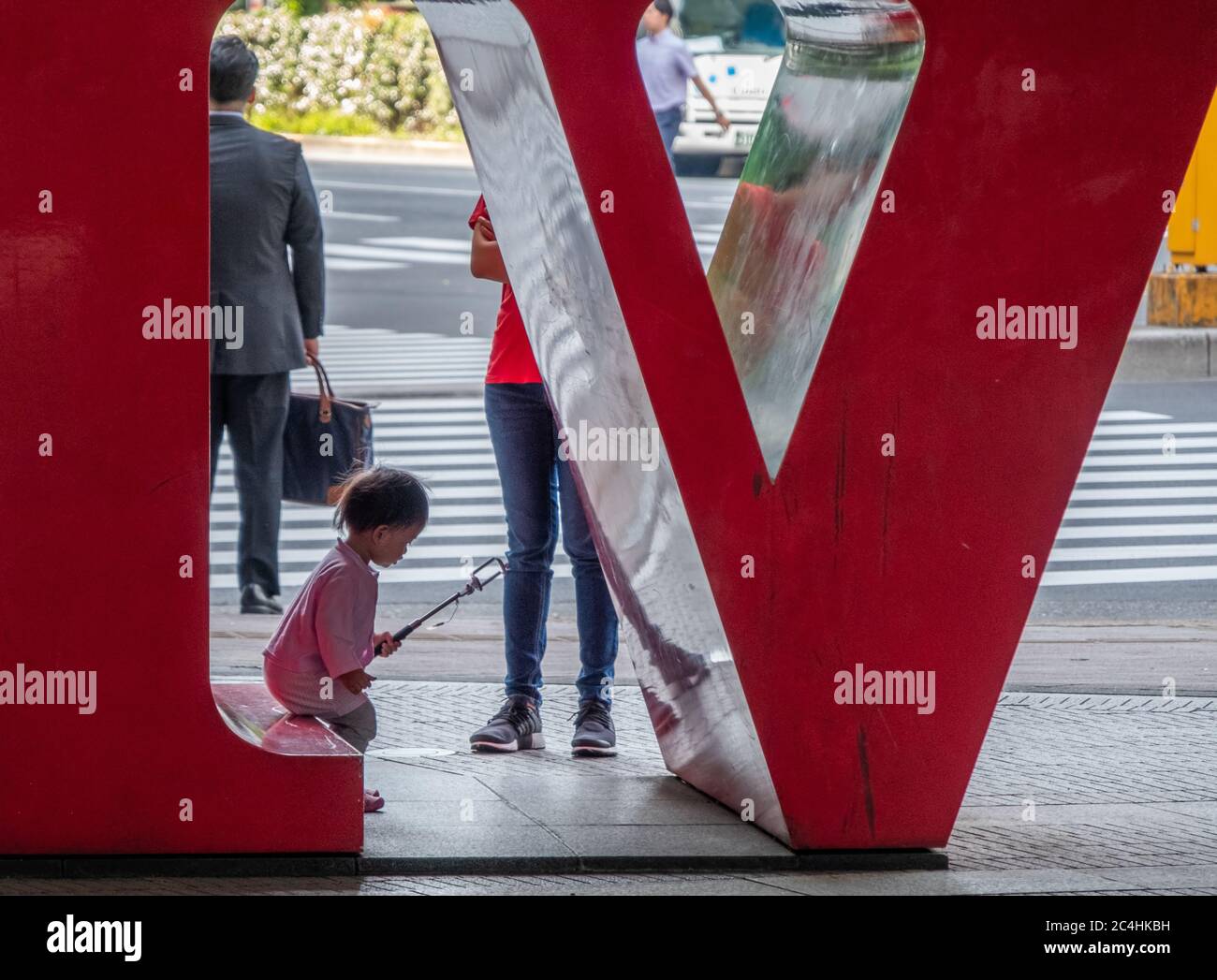 Tourist at the LOVE statue in Shinjuku, Tokyo, Japan Stock Photo Alamy
