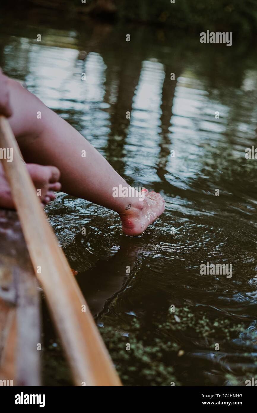 Young attractive woman punting in Oxford, UK Stock Photo