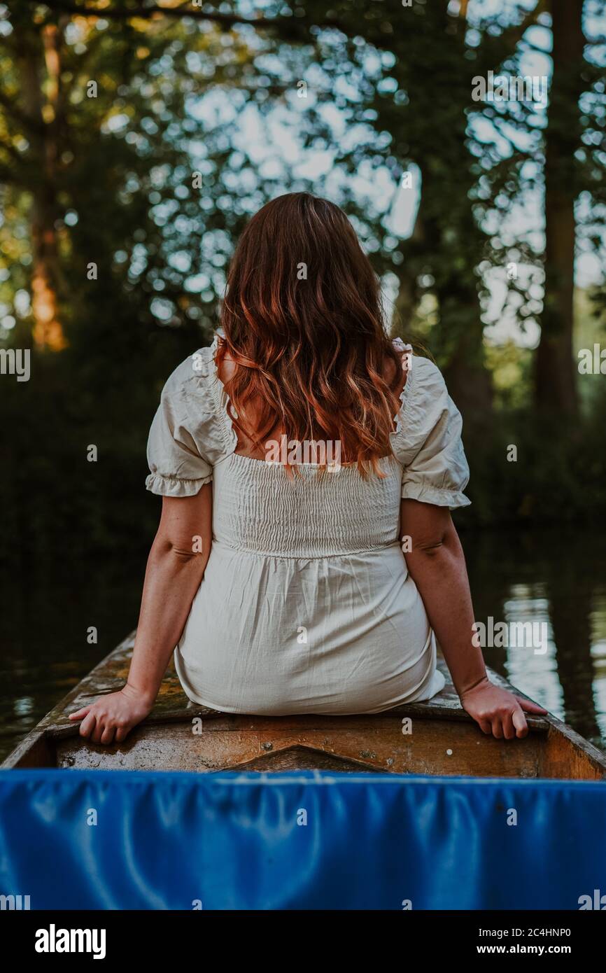 Young attractive woman punting in Oxford, UK Stock Photo