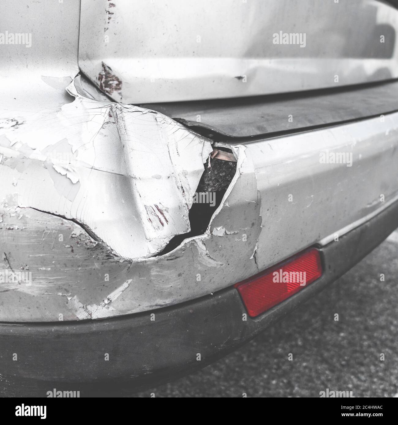 Dented car. Vehicle bumper dent broken by car crash. Road accidents. Stock Photo