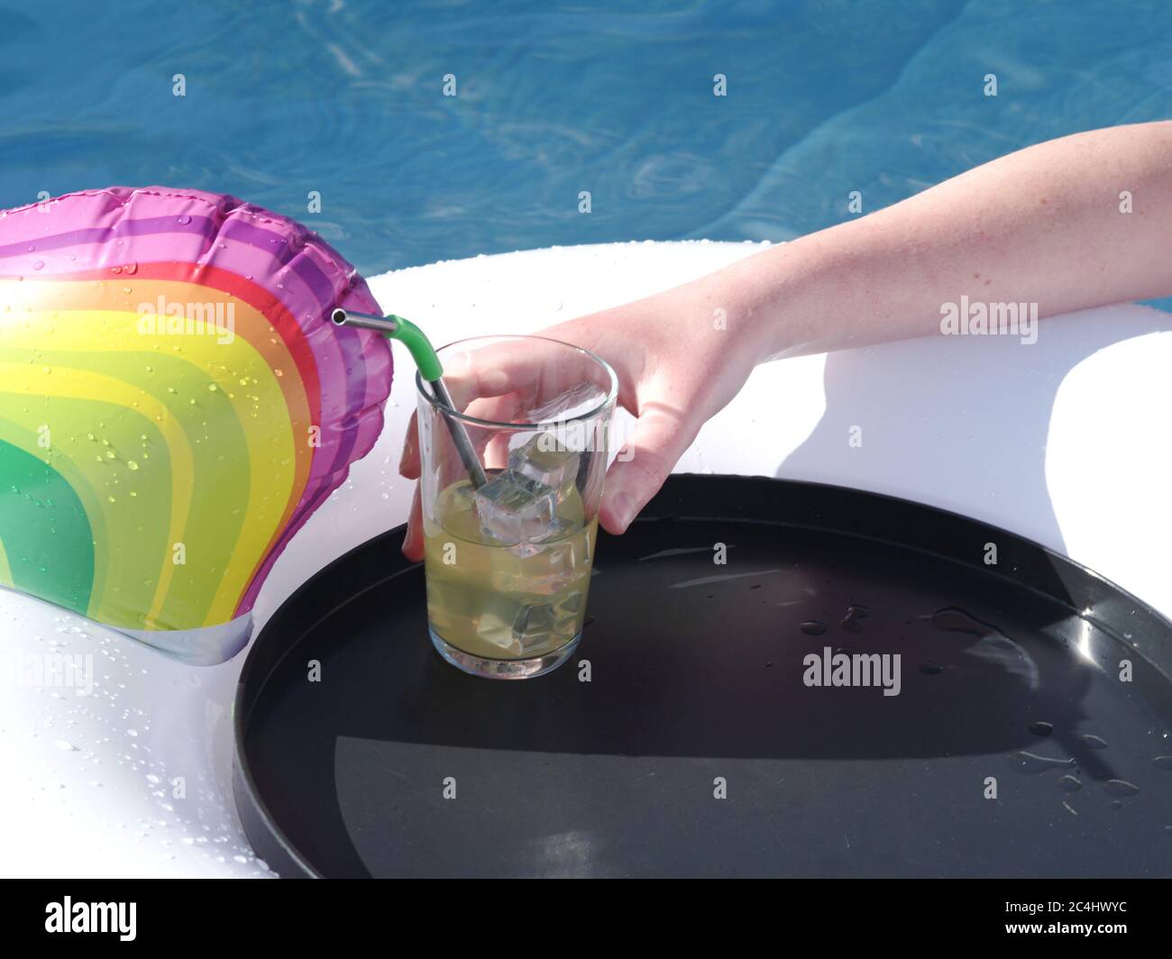 Swimming pool inflatable and drinks tray Stock Photo