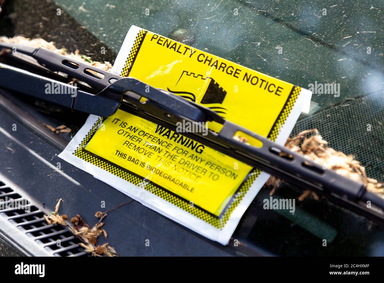 Parking ticket behind a windshield wiper in Tower Hamlets, London, UK Stock Photo