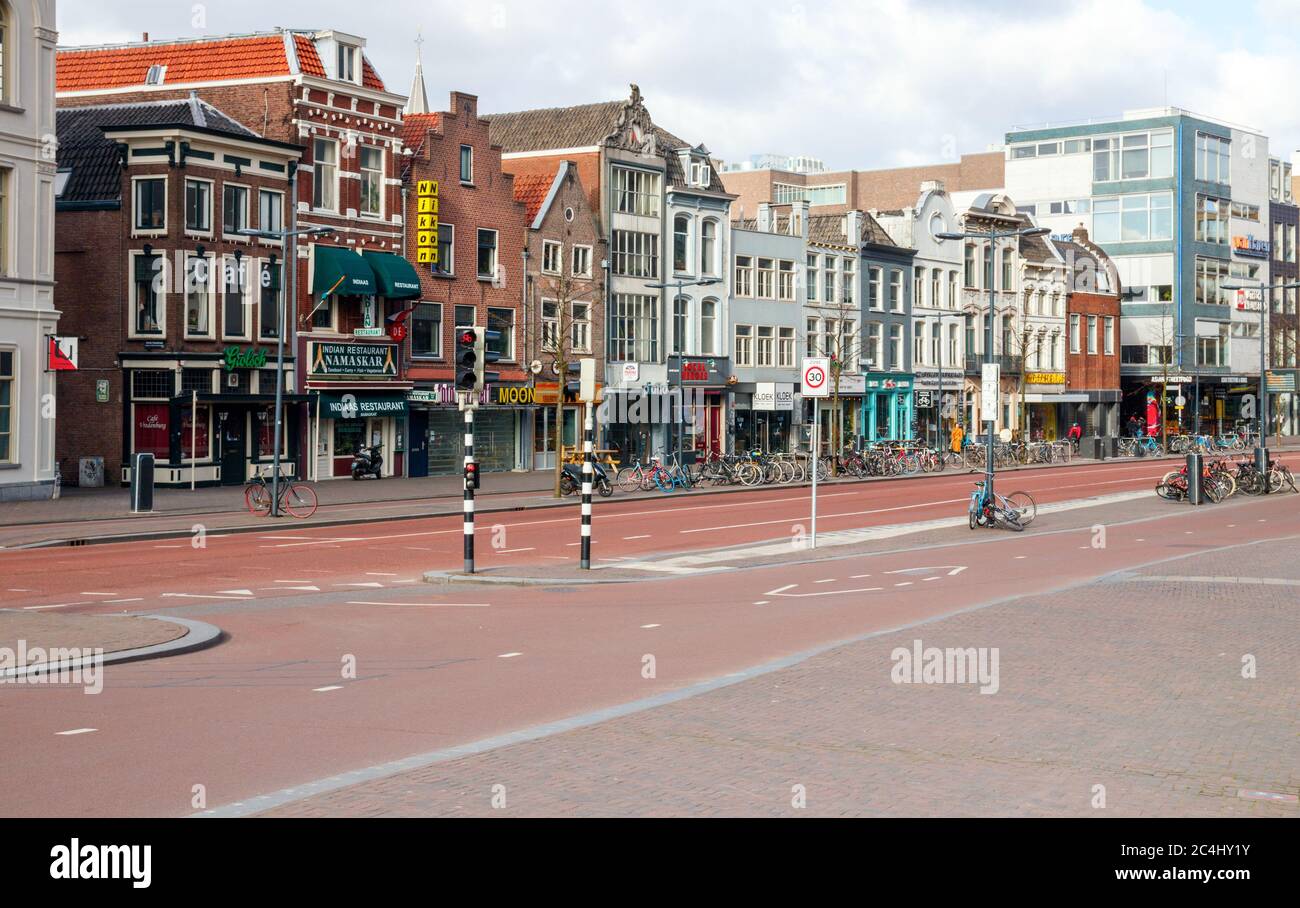 View of a desolate Vredenburg street with closed shops. Due to the Ccorona pandemic it is quiet in the Utrecht city centre. The Netherlands. Stock Photo