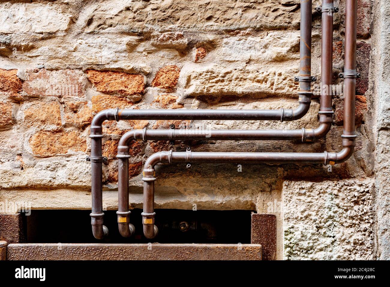 Metal pipes of the water pipe on the wall Stock Photo Alamy
