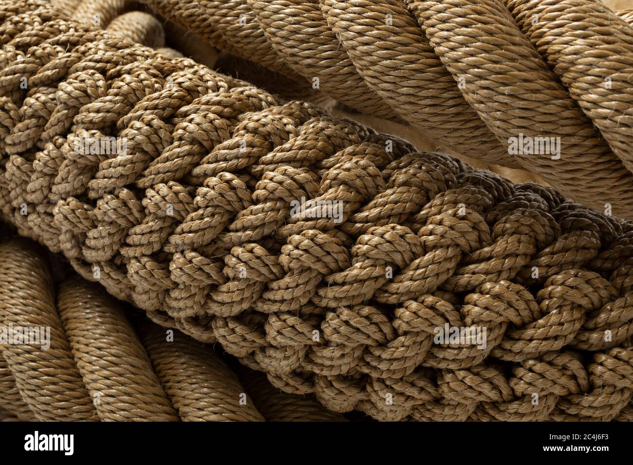 New handmade knotted rope close up full frame with different knots Stock Photo