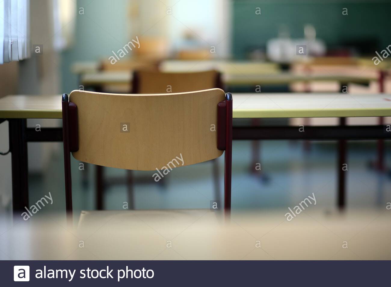 Unoccupied school chairs and desks in Germany during the Corona crisis. It is hoped to return to normal lessons soon. Stock Photo
