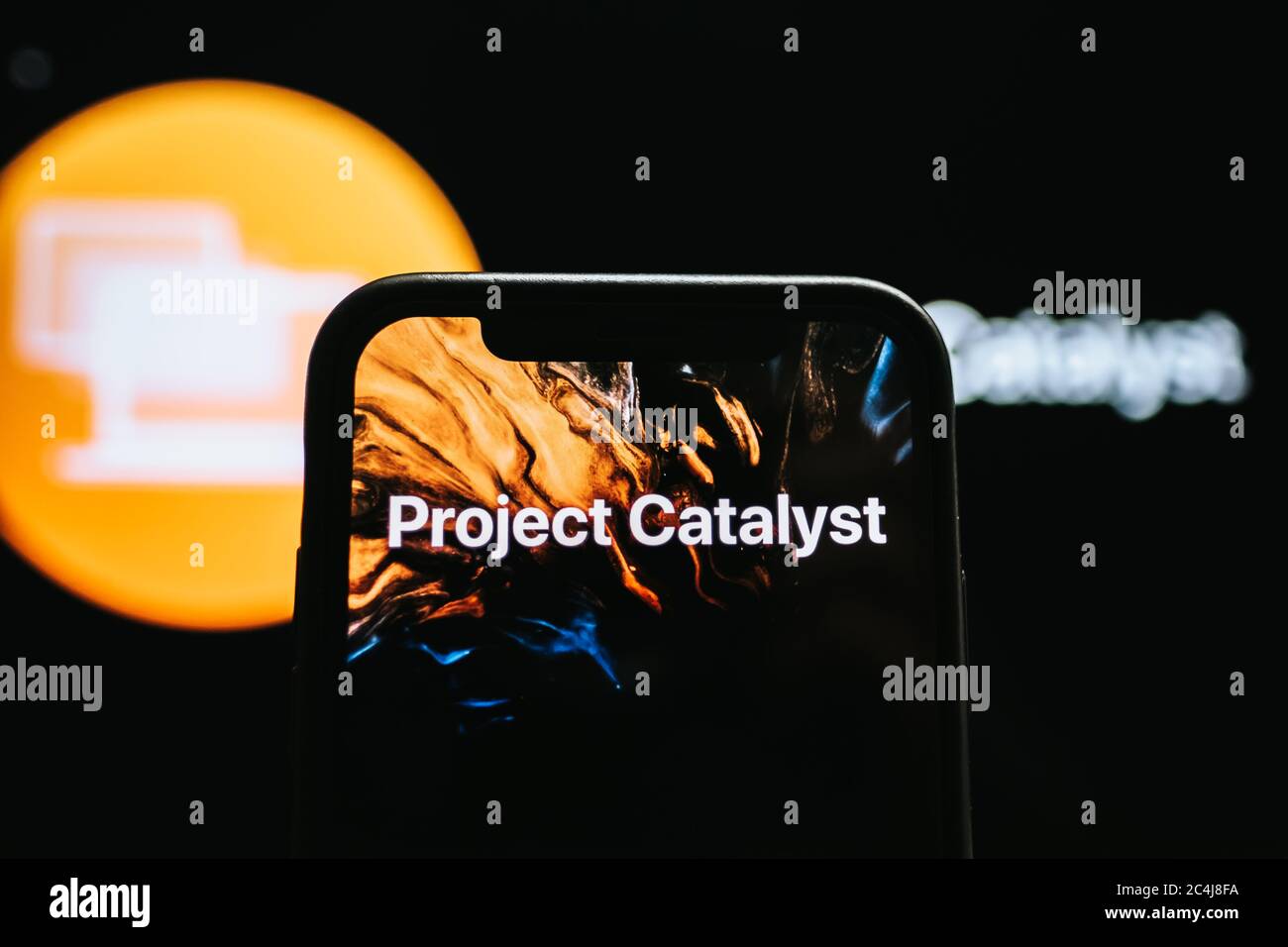 hand holding the iPhone with apple project catalyst logo on the screen Stock Photo