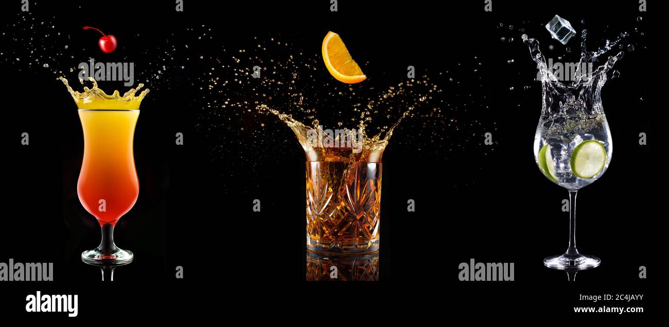 set of cocktail glasses splashing on black background Stock Photo