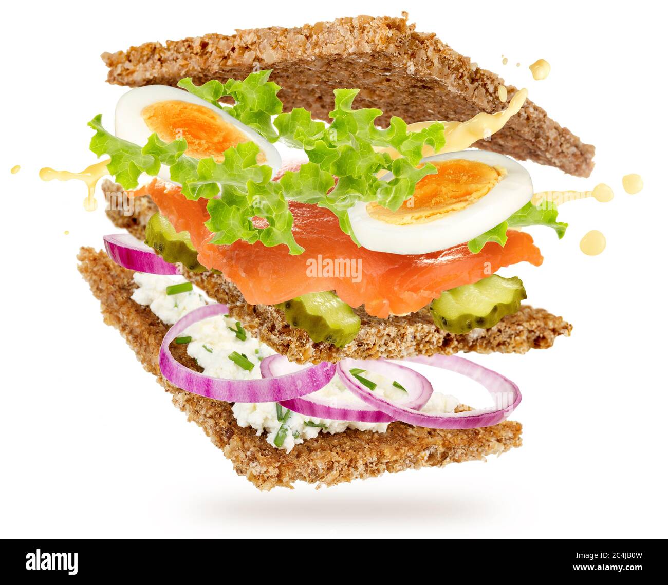 salmon and eggs sandwich floating isolated on white background Stock