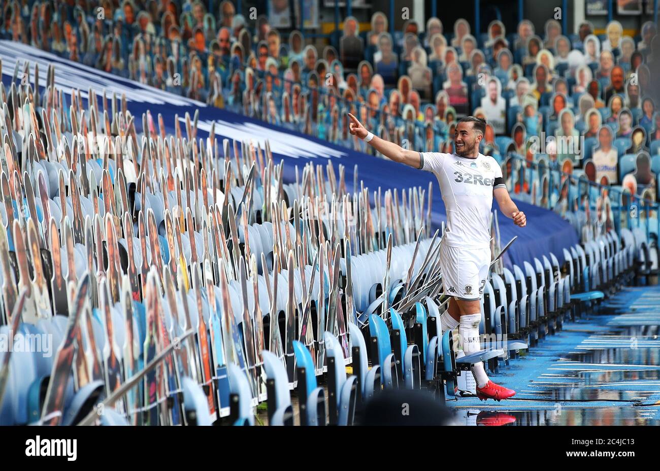 Leeds uniteds jack harrison celebrates amongst cardboard cutouts fans