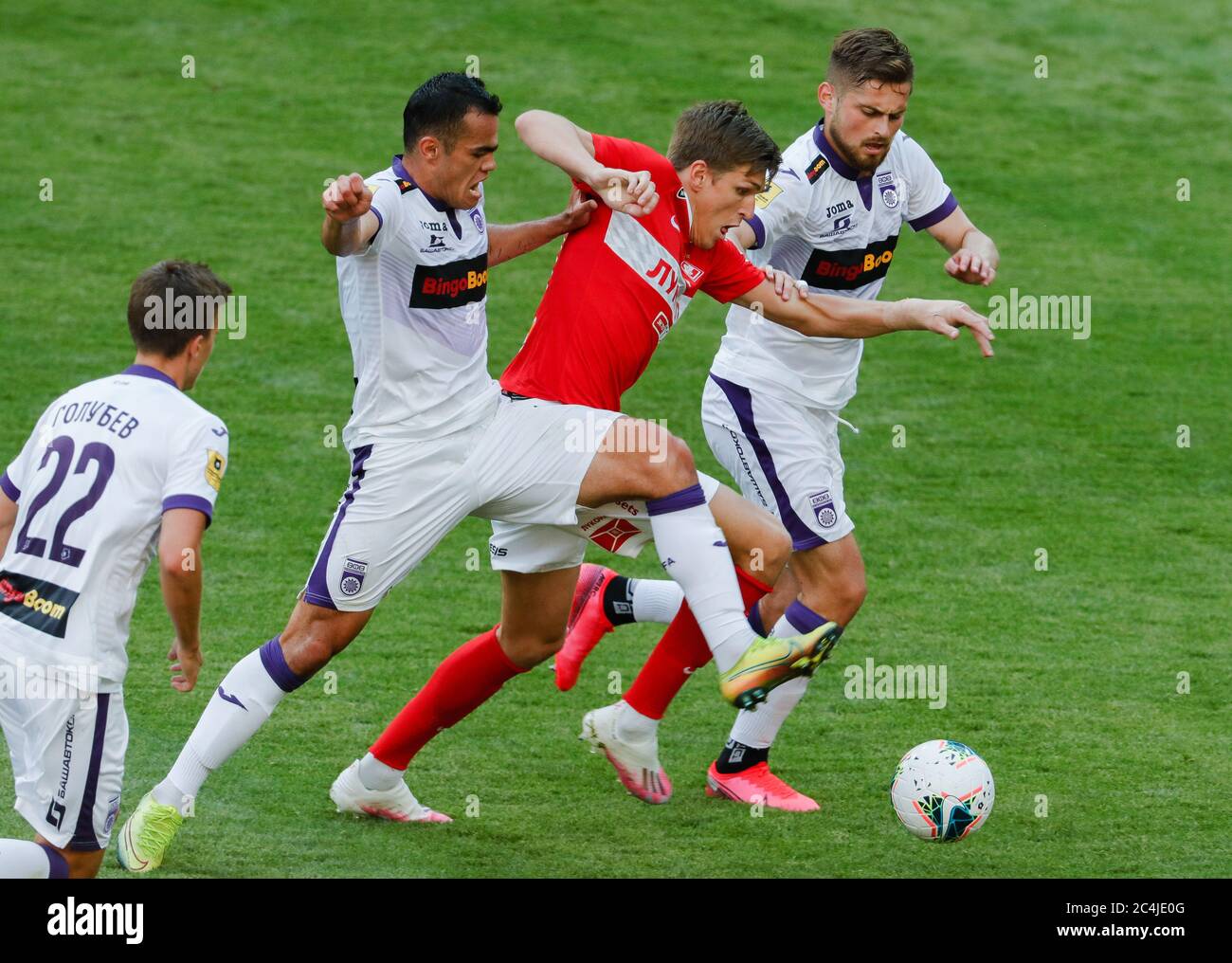 Moscow, Russia. 27th June, 2020. FC Ufa's Oston Urunov, FC Spartak Moscow's  Roman Zobnin and FC Ufa's Catalin Carp (L-R background) fight for the ball  in their 2019/2020 Russian Premier League Round