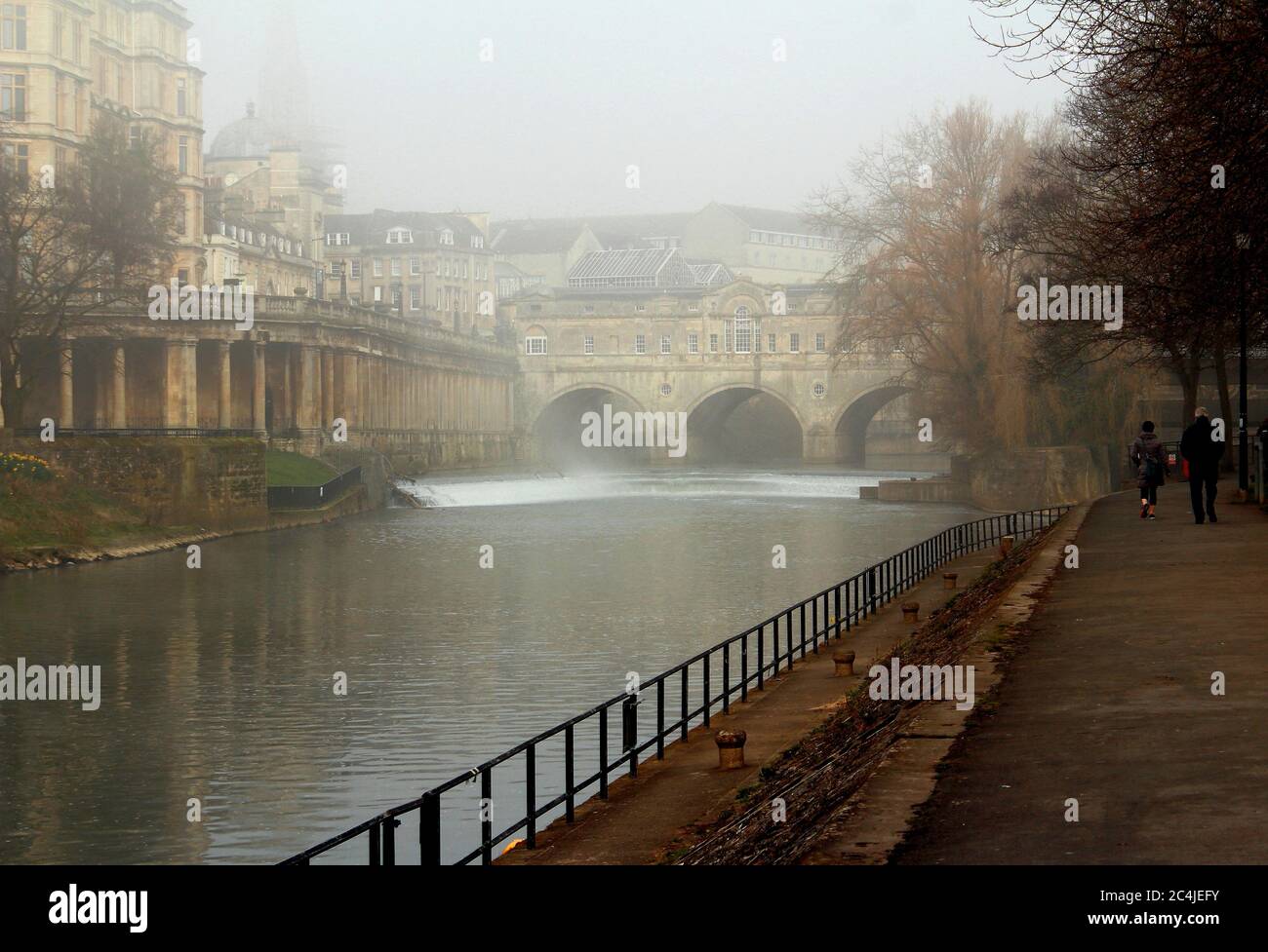 View of the Empire building and Pulteney Bridge on the River Avon,Bath in a misty,foggy day. Stock Photo