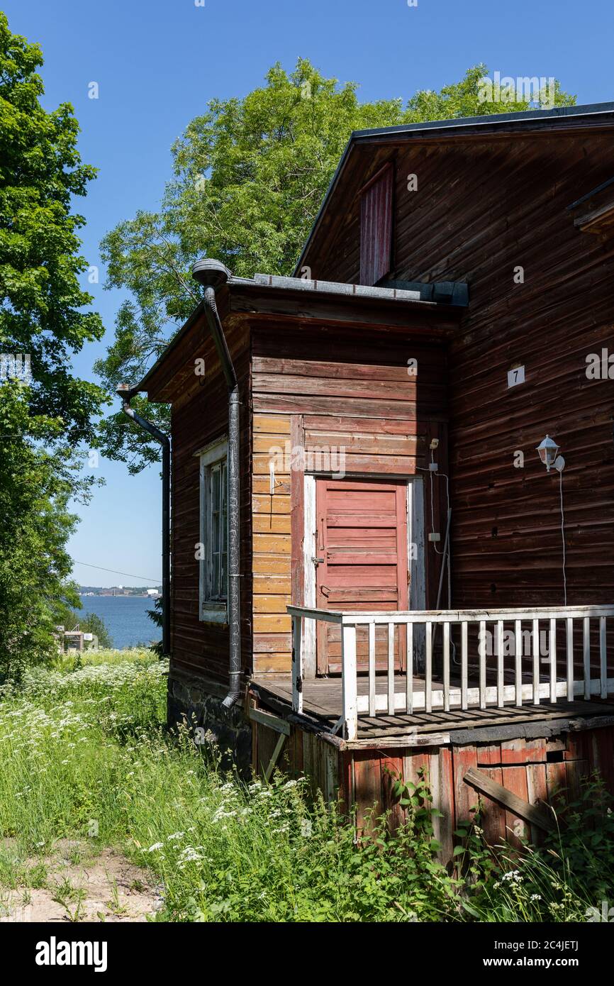 Old desolate wooden residential building in Vallisaari, former military island, now a day trip destination in archipelago of Helsinki, Finland Stock Photo