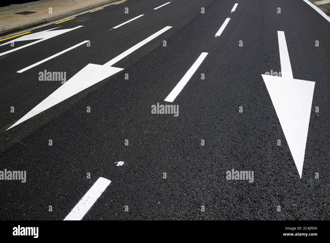 Arrow directional signals painted on the floor in Spain Stock Photo