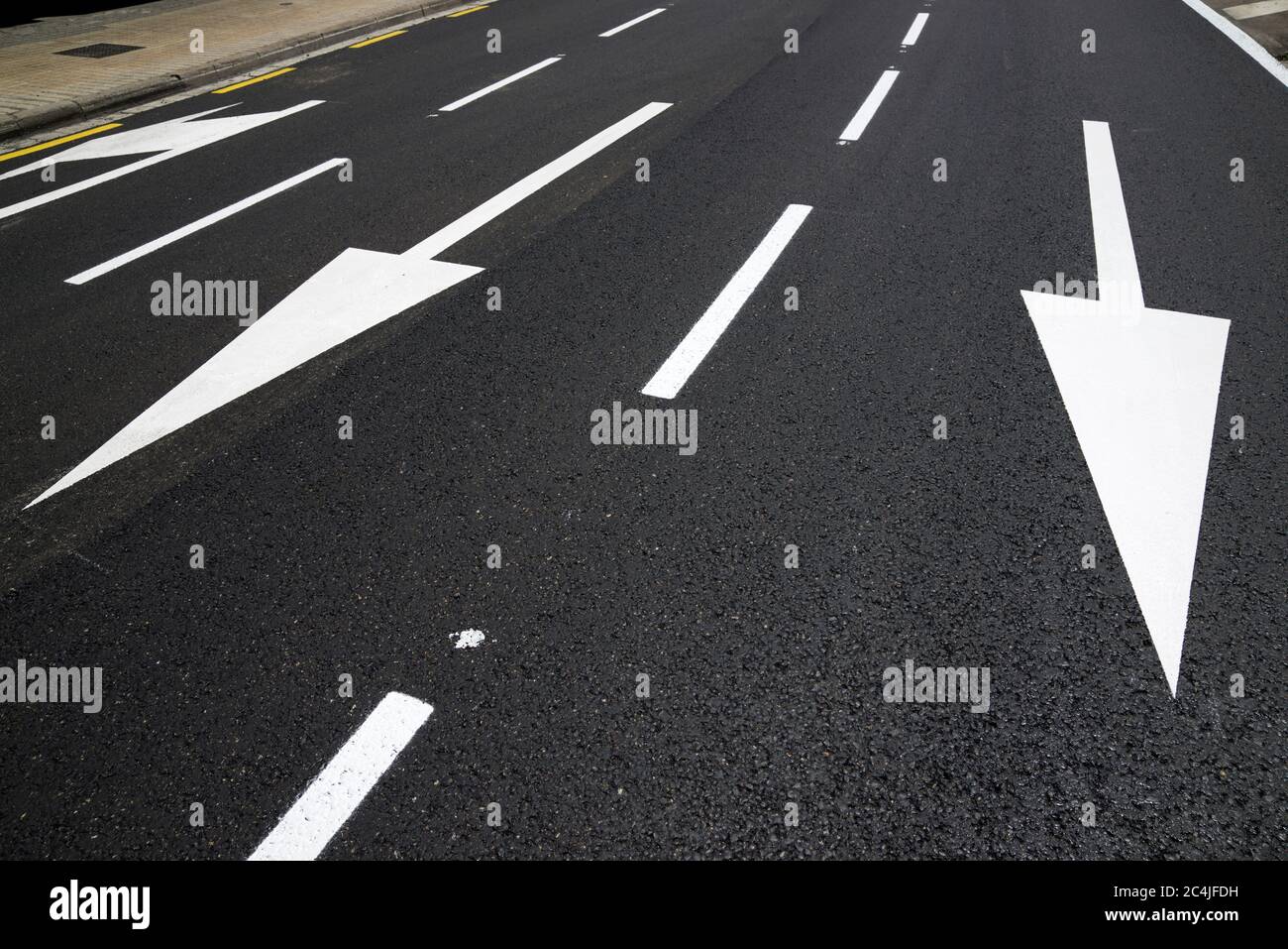 Arrow directional signals painted on the floor in Spain Stock Photo - Alamy