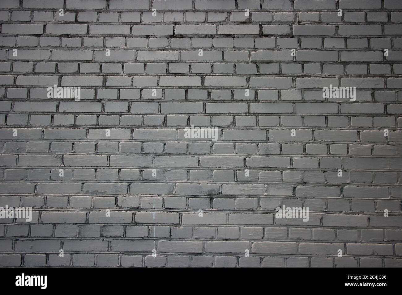 Weathered old grunge grey white brick wall background texture Stock Photo