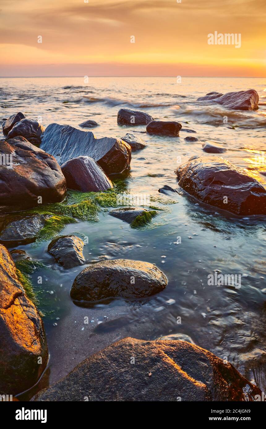 Rocks in water sunset hi-res stock photography and images - Alamy