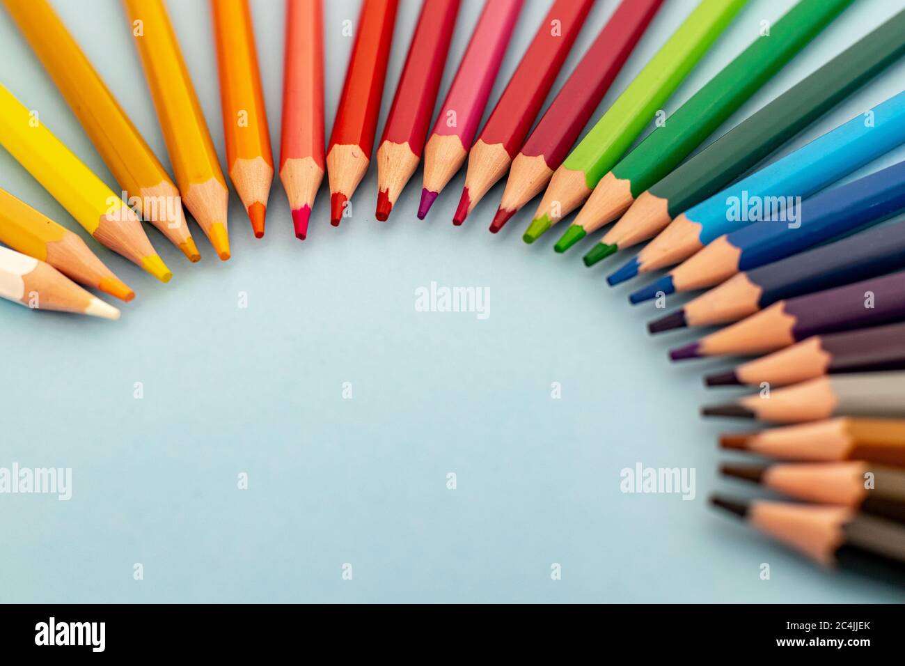 A Set Of Coloured Pencils Lined Up In The Form Of A Rainbow Stock Photo Alamy