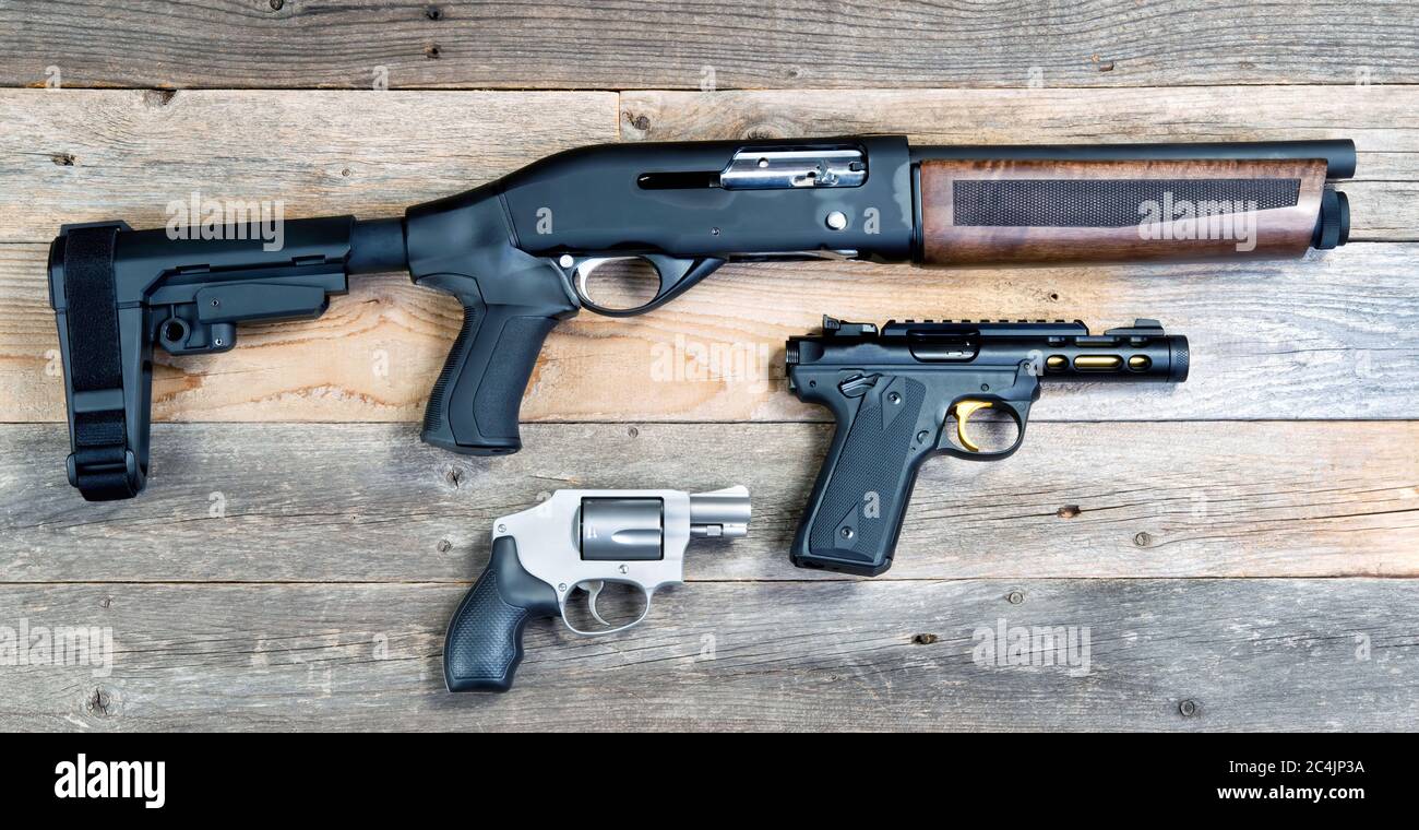 Home security shotgun,revolver and semi automatic pistol. Stock Photo