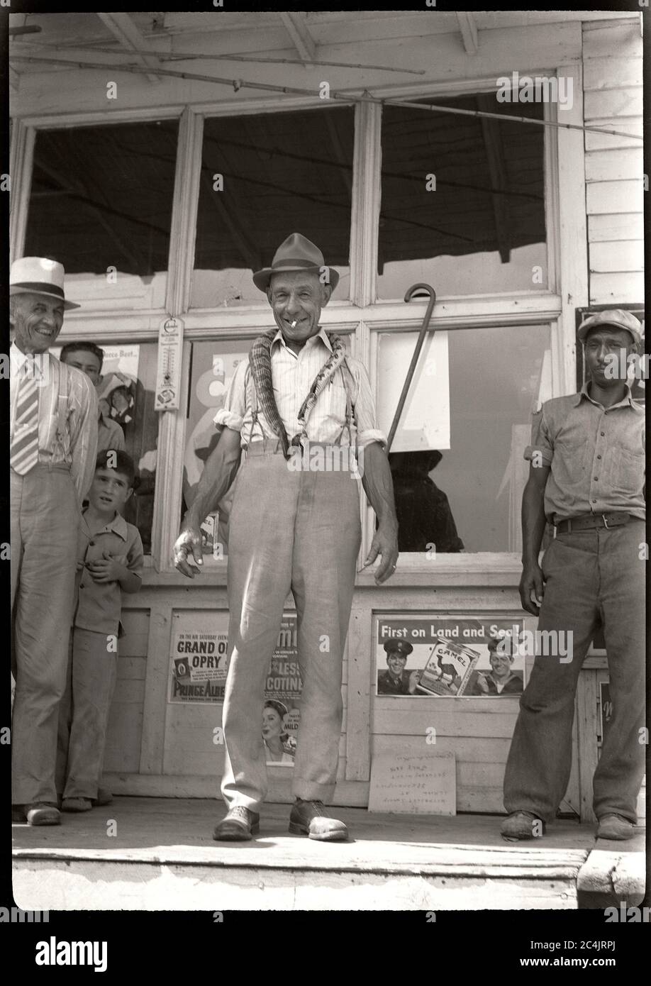 Man Standing At Store Front Wearing A Snake Around His Neck Circa 1940s Image From 2 5 X 3 5 Inch Negative Stock Photo Alamy Man Standing At Store Front Wearing A Snake Around His Neck Circa 1940s Image From 2 5 X 3 5 Inch Negative Stock Photo Alamy