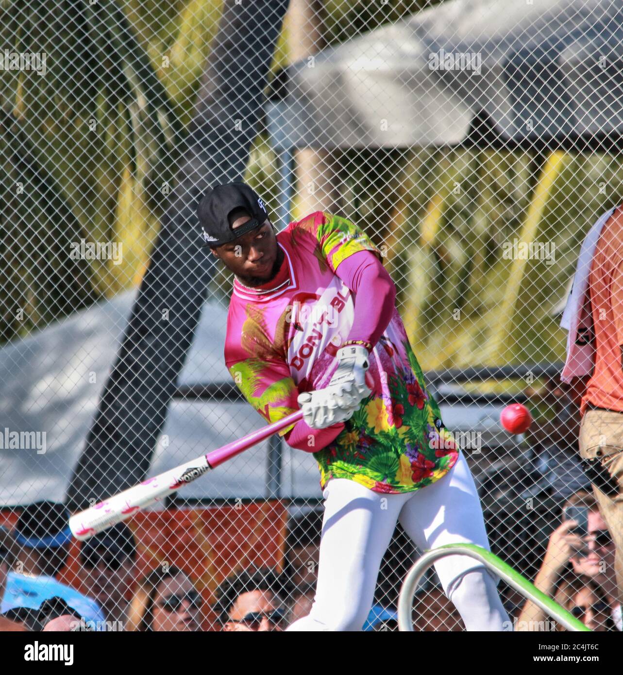 Baseball Softball Action Little league batter hits ball Stock Photo - Alamy