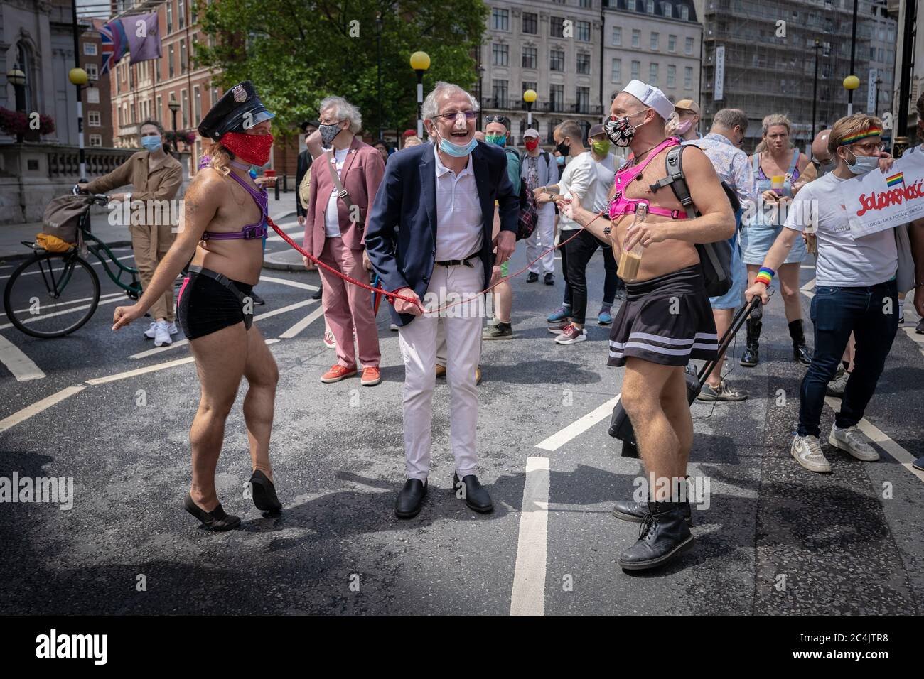 London, UK. 27th June, 2020. 50th Anniversary March of Gay Liberation Front (GLF). About forty LGBT+ activists and supporters march along the same route that the cancelled Pride parade was due to follow. Marchers include twelve of the last surviving activists from the London Gay Liberation Front, 1970-74, some now in their 70s and 80s, in celebration of the 50th anniversary of GLF and to reclaim Pride with political demands. Credit: Guy Corbishley/Alamy Live News Stock Photo