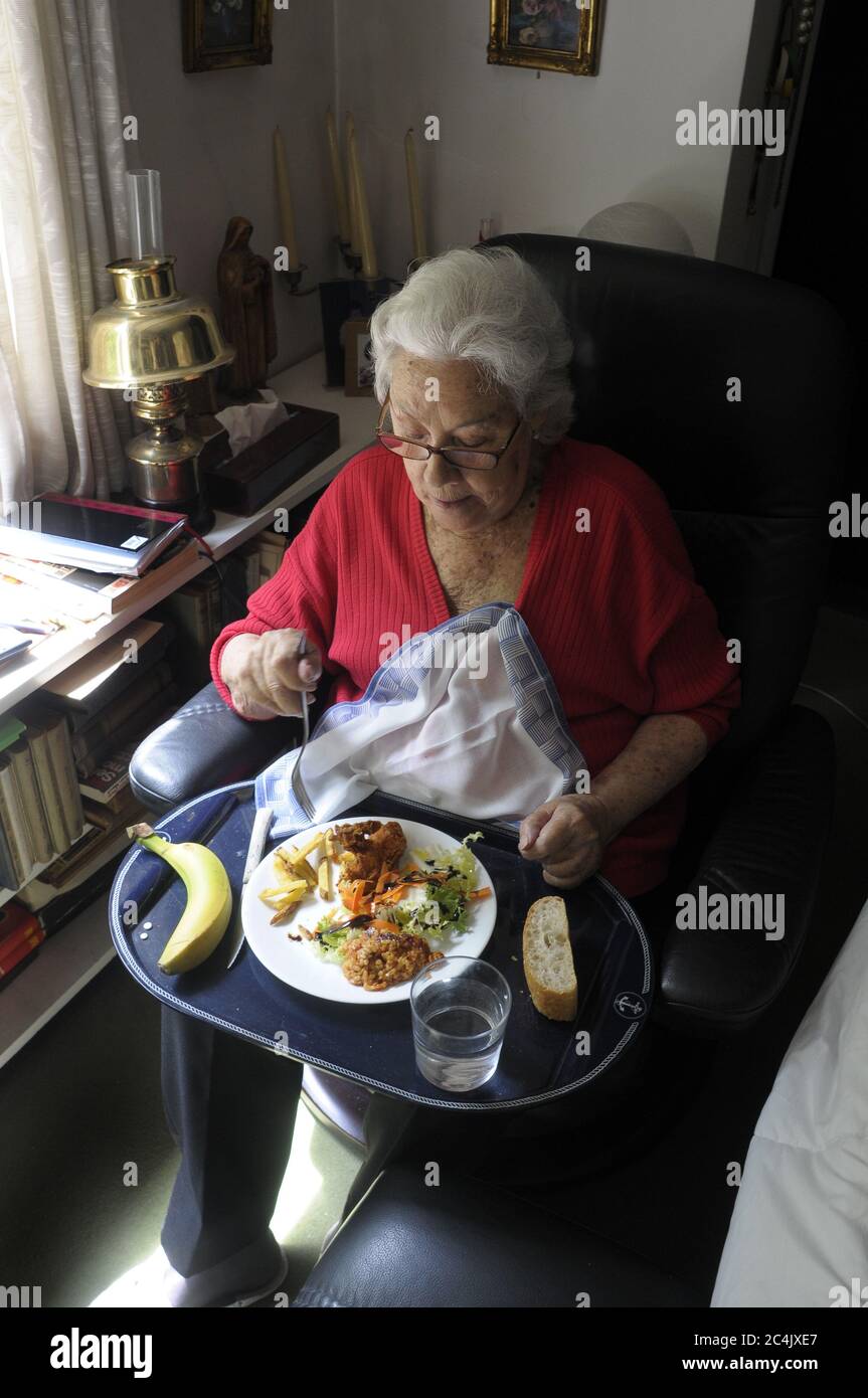 elderly person eating seated upright position