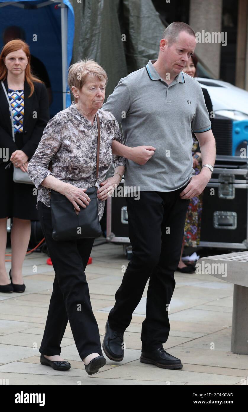 Family members of David Wails, one of the three victims killed in the Reading terror attack in Forbury Gardens in the town centre, shortly before 7pm on June 20, walk together to light candles during a vigil at Market Place, Reading, in memory of Mr Wails and his friends, Joseph Ritchie-Bennett and James Furlong. Stock Photo