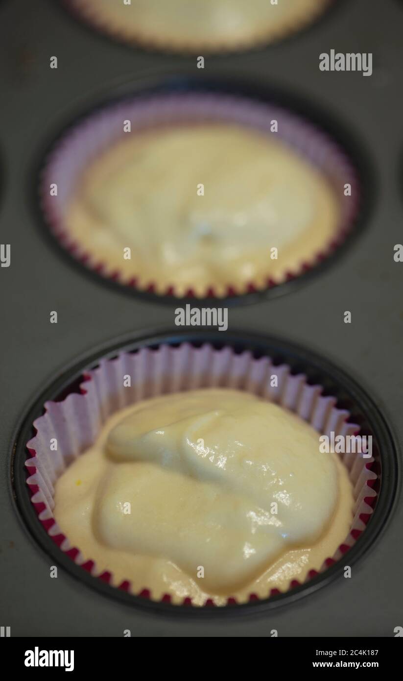 Cupcake batter in cupcake cups Stock Photo