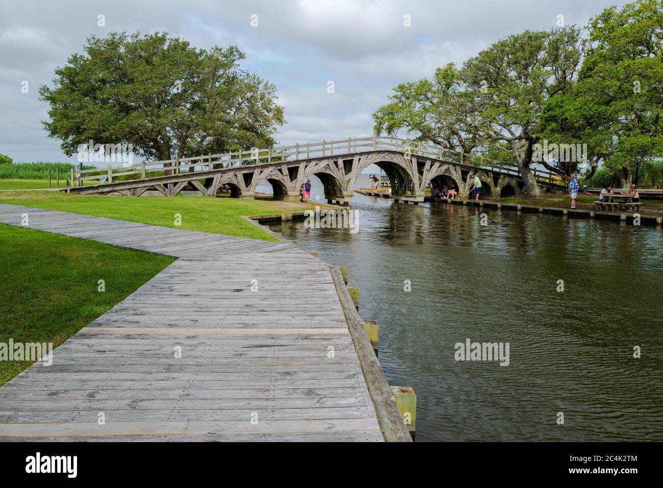 Corolla Park, North Carolina, USA June 10, 2020. A wide angle photo of people fishing by