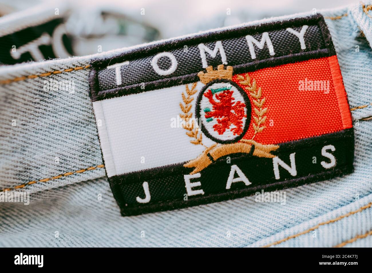 Closeup of Tommy Hilfiger label on blue jeans Stock - Alamy