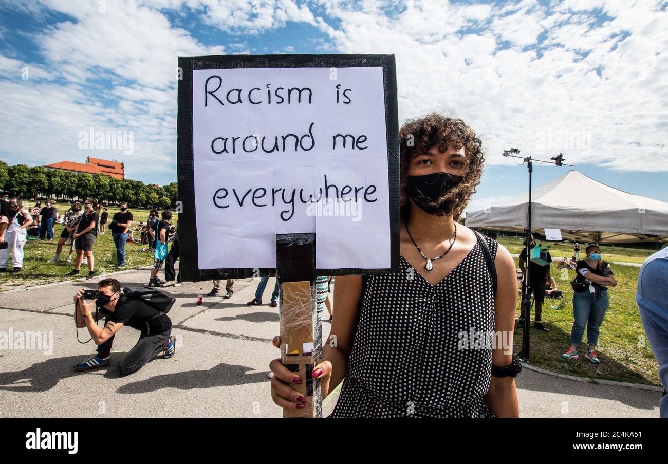 June 27, 2020, Munich, Bavaria, Germany: A woman in Munich, Germany demonstrates against the ongoing use of the N-word and states that racism is everywhere around her. In the wake of the killing of George Floyd and numerous other cases of police brutality and killings against People of Color, over 500 assembled in Munich, Germany to protest against the use of the so-called N-Word. In Germany, the continued use of the N-Word is defended by mainstream politicians, police, right-extremists, Pegida, Neonazis, and the middle of society, despite blacks stating the use is racist derogatory, and exc Stock Photo