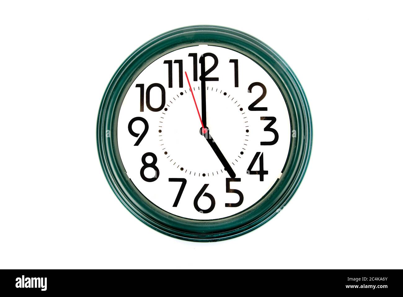 five o'clock on an old wall clock with large numbers Stock Photo