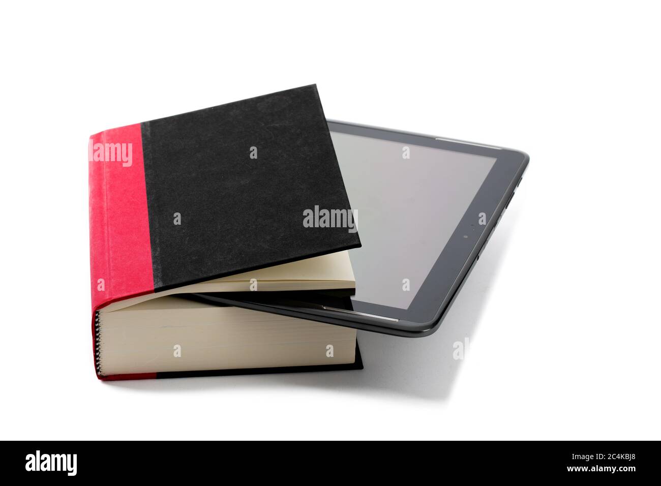 a computer tablet with an ebook reader app stuck into a hard cover