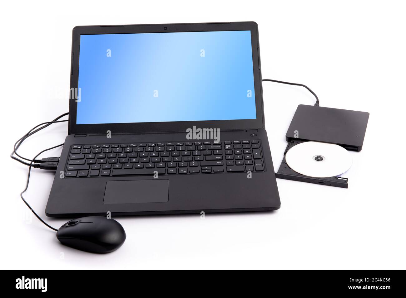 a notebook computer with an external DVD disk reader attached isolated on white Stock Photo
