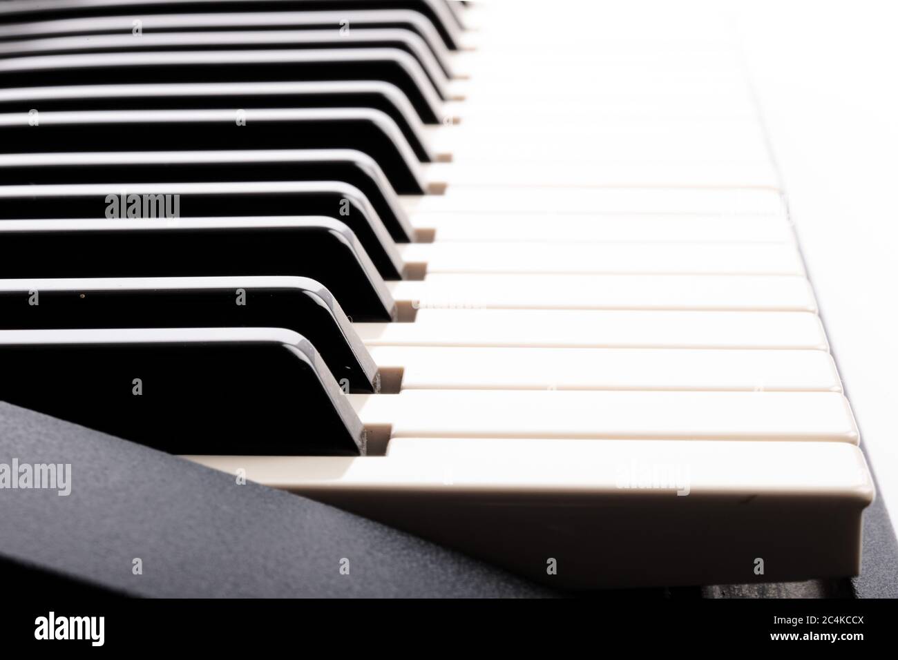 closeup looking along an electronic piano keyboard Stock Photo