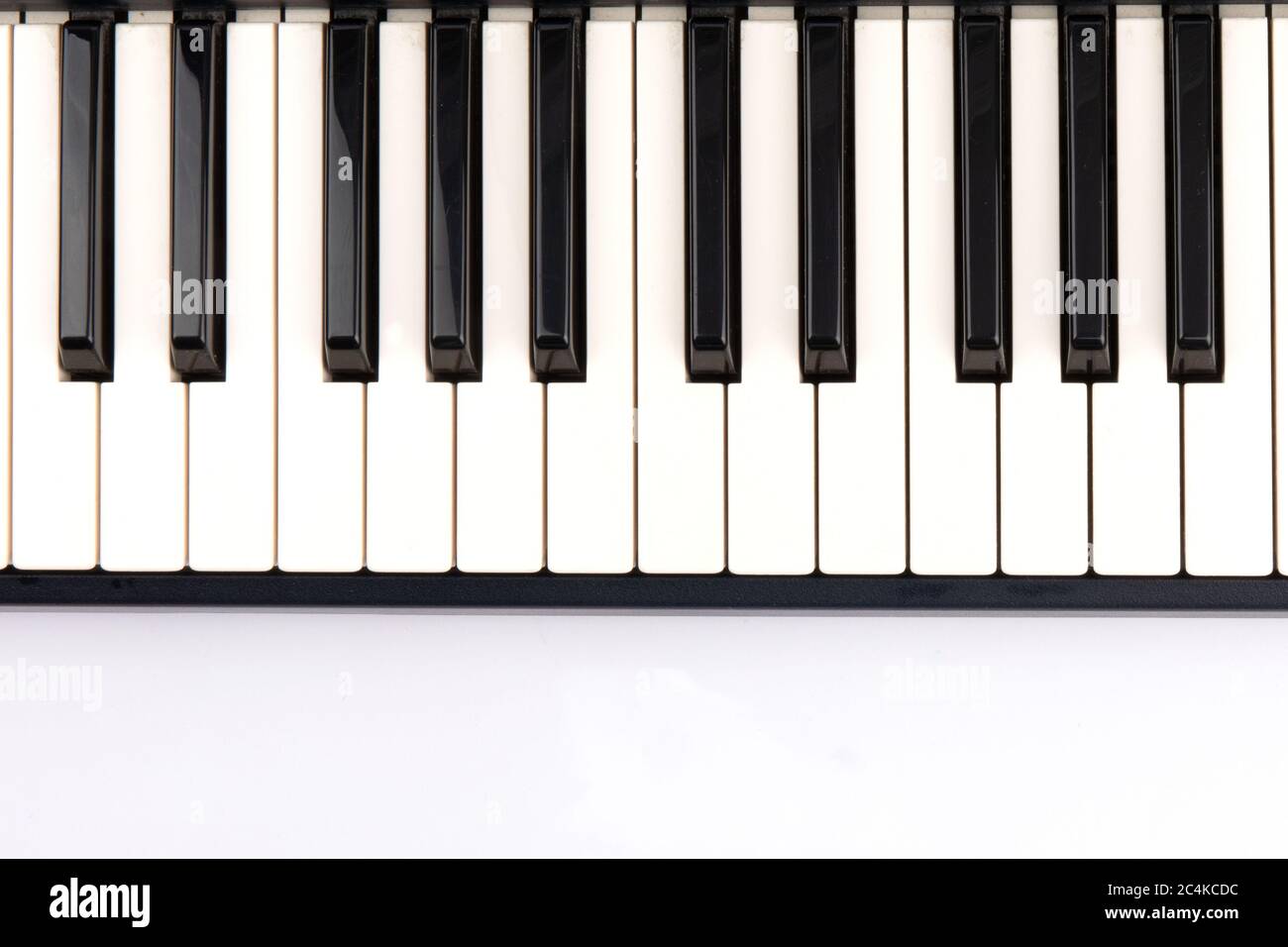 2 octave black and white keys of an electronic piano keyboard on a white  background Stock Photo - Alamy