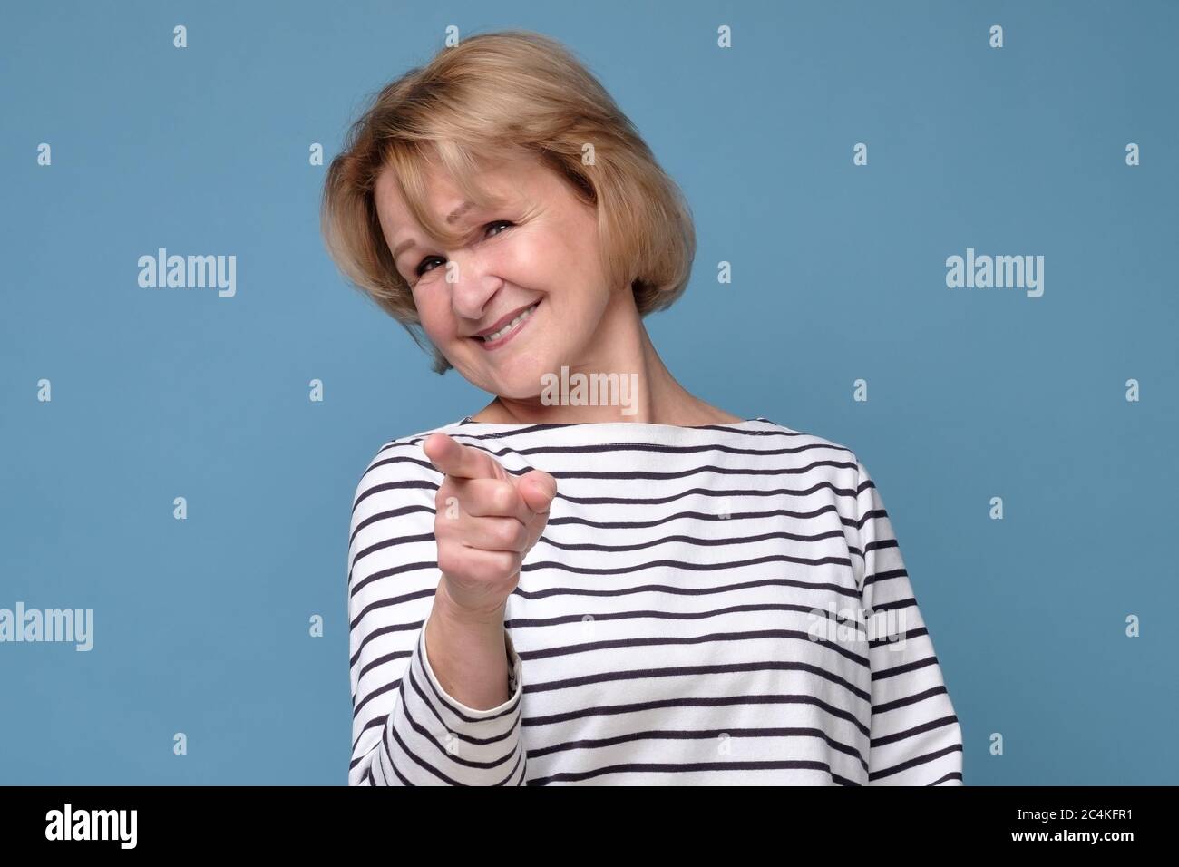 happy woman in blank white tshirt pointing at you Stock Photo Alamy