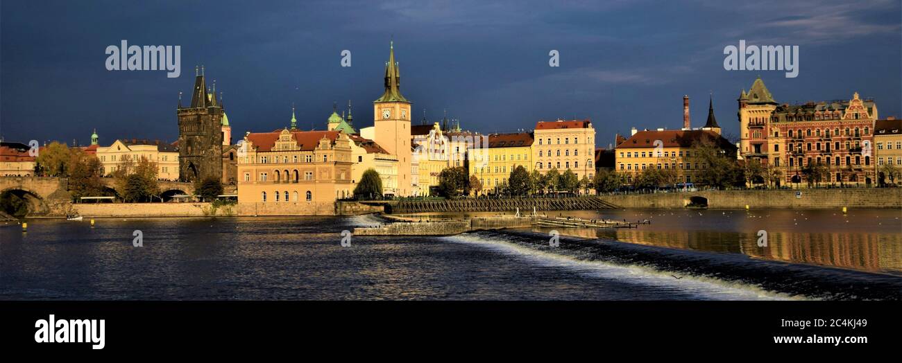 PRAGUE, CZECH REPUBLIC - Oct 25, 2019: Riverside of Prague with the Charles Bridge Stock Photo