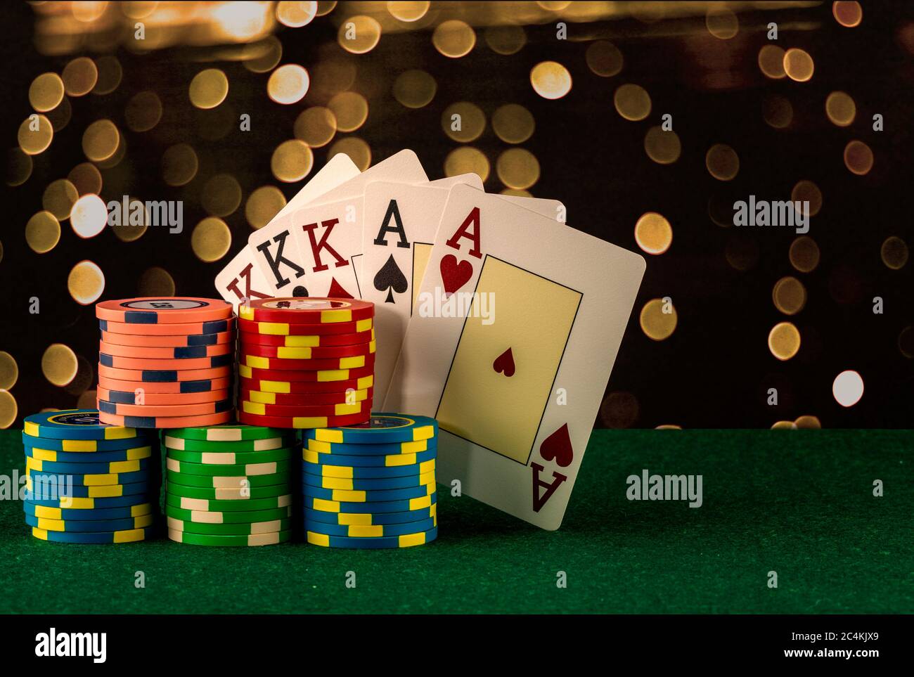 Casino game elements such as colored chips, poker cards and money Stock Photo