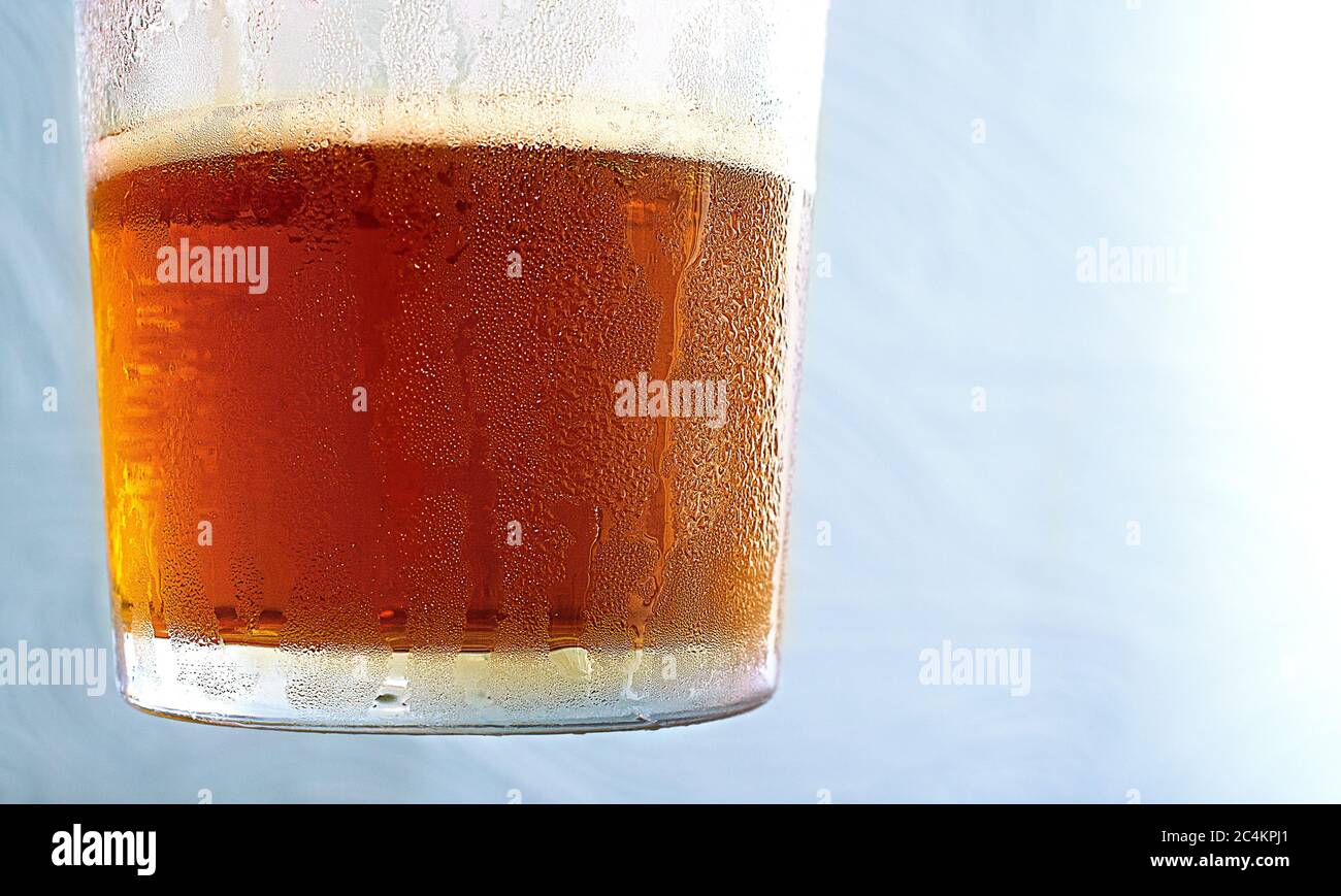 Glass of almost finished chilled amber pale ale beer Stock Photo Alamy
