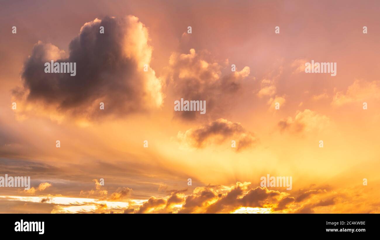 Beautiful Summer sunset sky with heart shaped cloud and colorful ...
