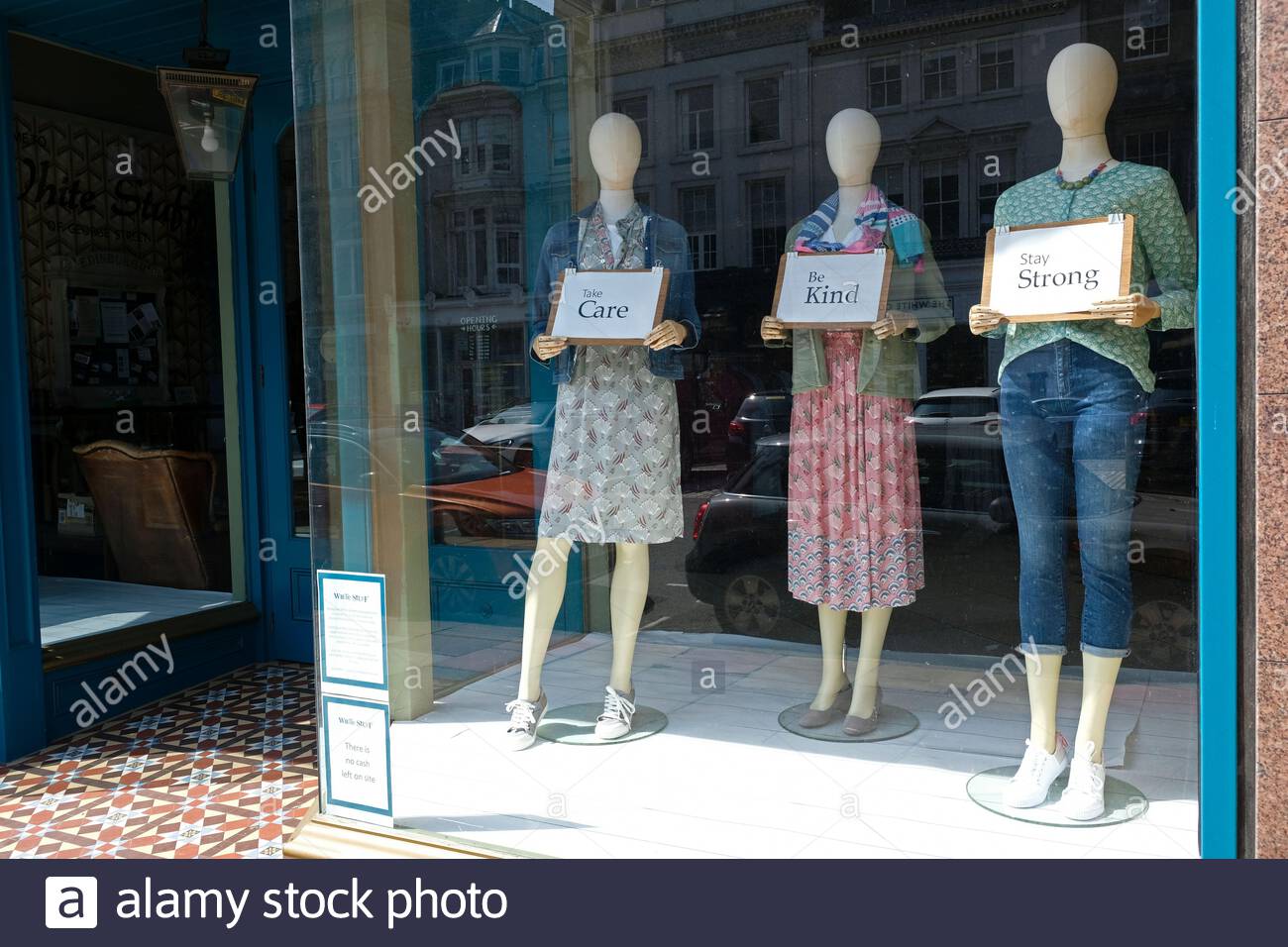 Mannequins in closed shop window with messages of support during the Coronavirus Covid-19 lockdown Stock Photo