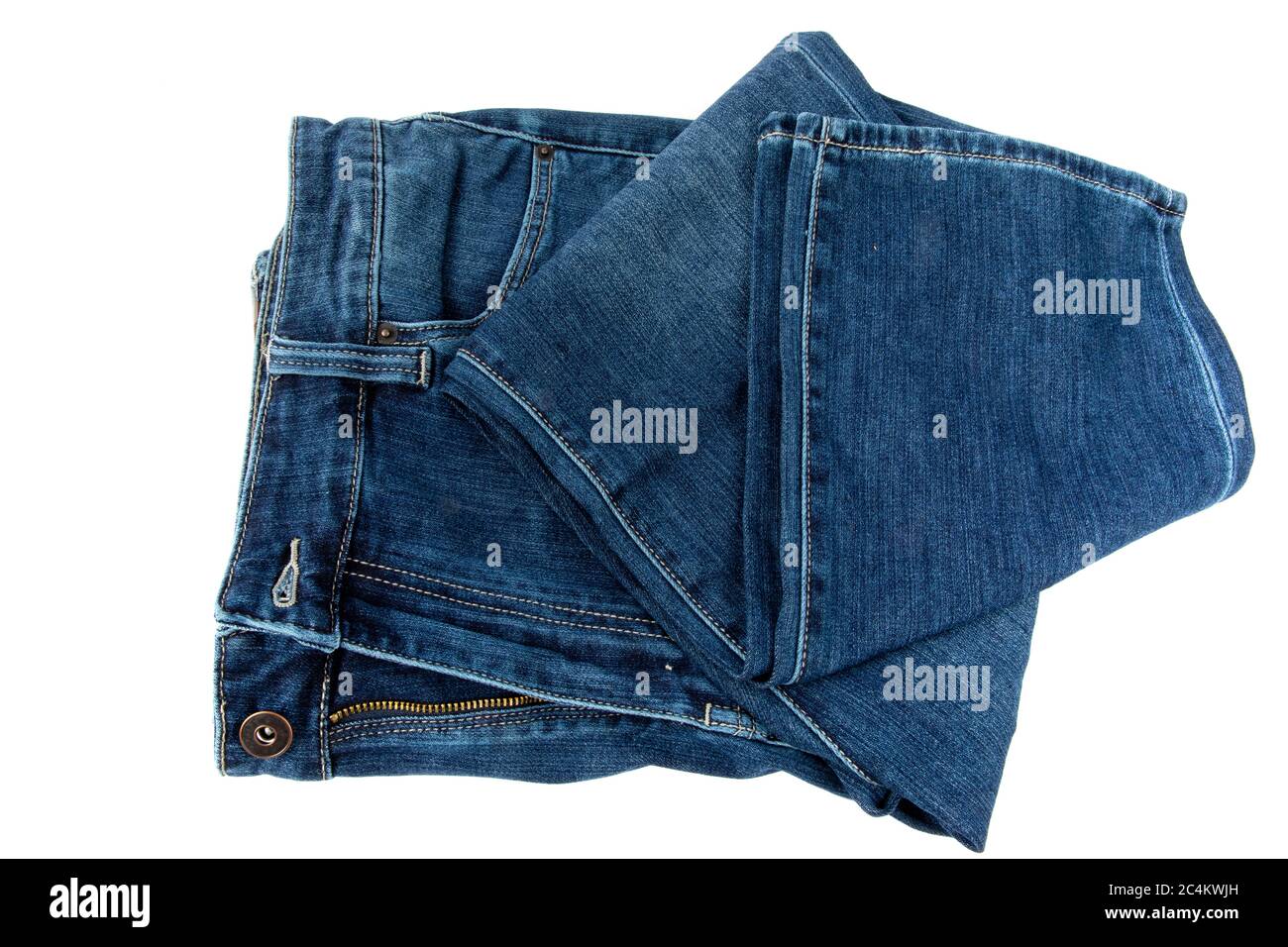 a pair of loosely folded denim blue jeans isolated on white Stock Photo