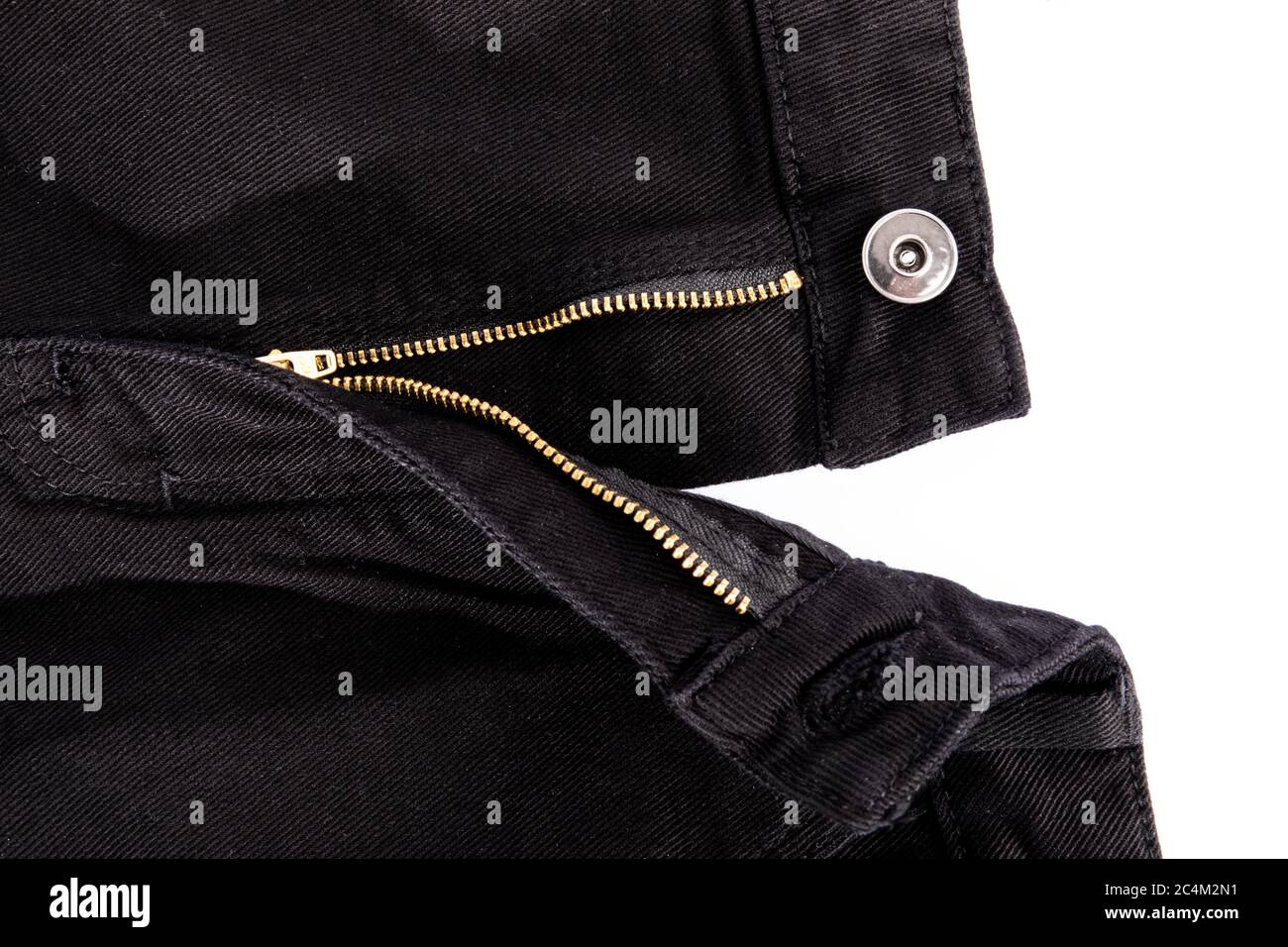 The open zipper of black denim jeans open on a white background Stock Photo